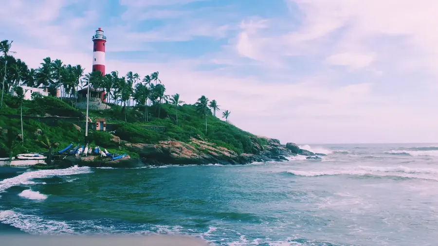 Kovalam beach Kerala, crescent bay, lighthouse, turquoise Arabian sea, palm trees